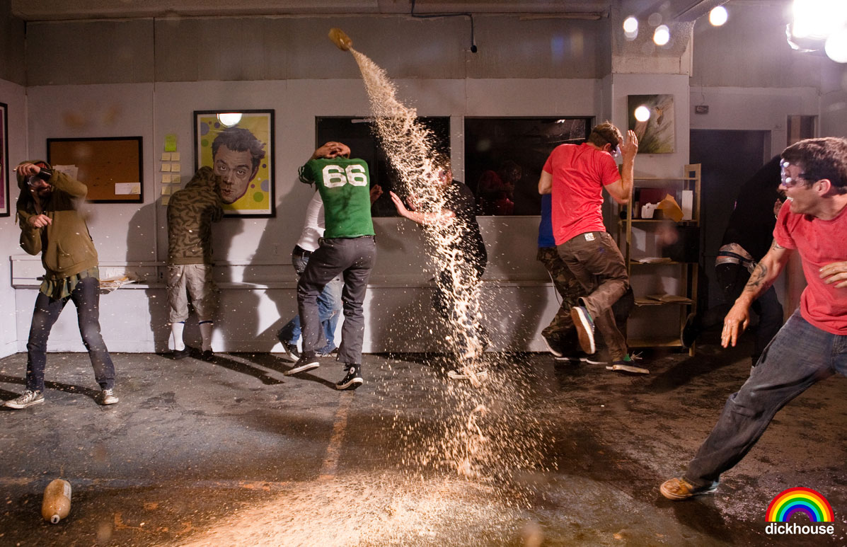 Youths run away from a sticky bomb exploding